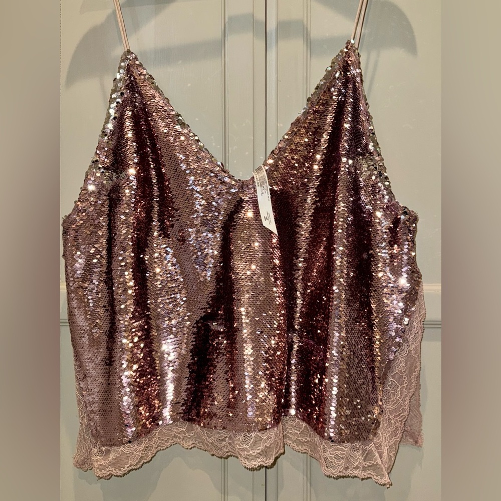Free People Sequin cami in rose gold. Side slits with delicate lace trim. Fun!